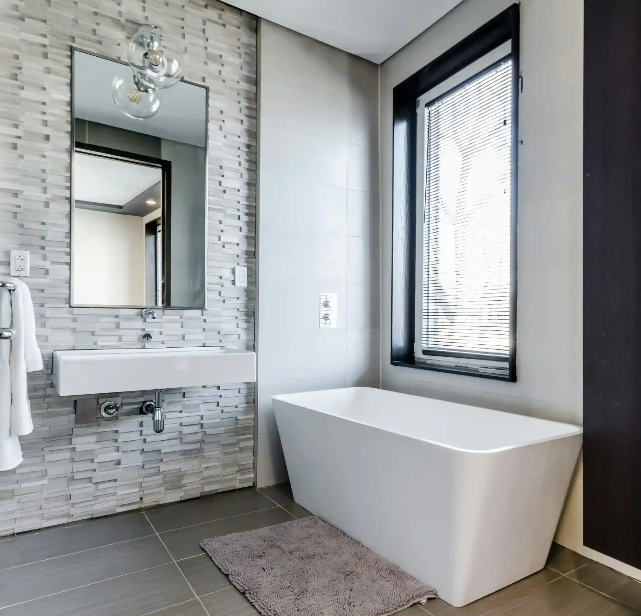 Mosaic accent wall in a Northwest Denver bathroom renovation